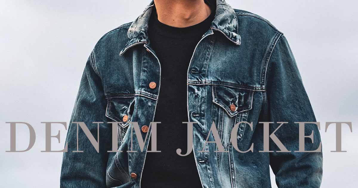 A classic Denim jacket layered over black tshirt which is shown to express the classic history of it
